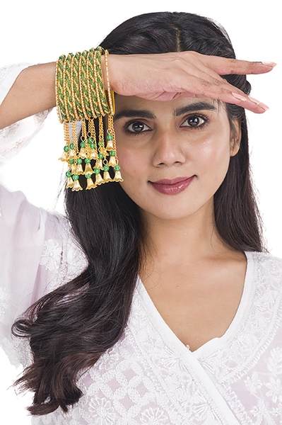 Gold and Green Color Gold Plated Metal Latkan Bangles Set together in one hand