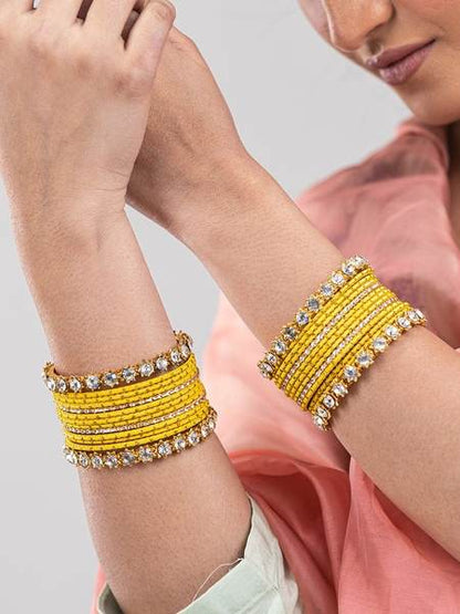 Golden and Yellow Metal Bangles Set Pack of 26 together in two hands