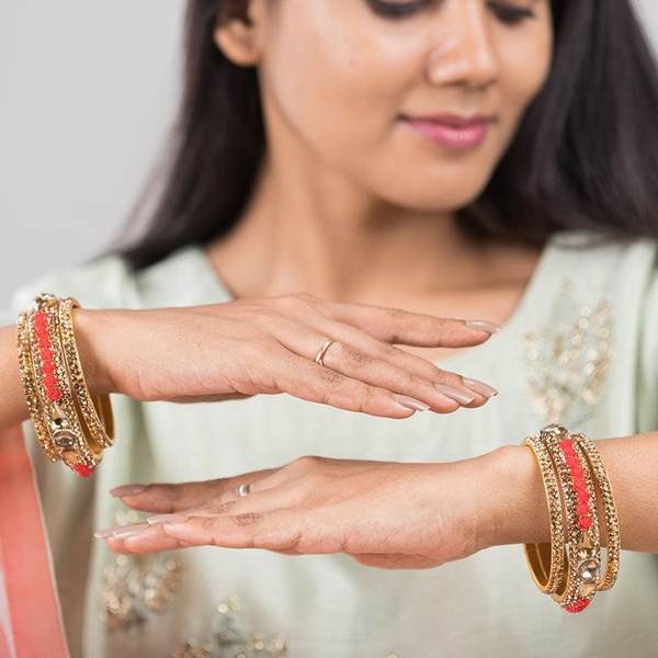 Metal with Zircon Gemstones Glossy Finished Gold & Red Color Bangles Set together in two hand